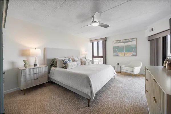 a bed room with bed and window