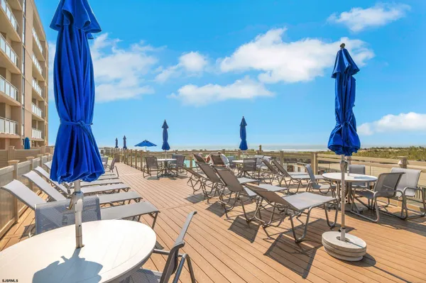 a view of a terrace with furniture