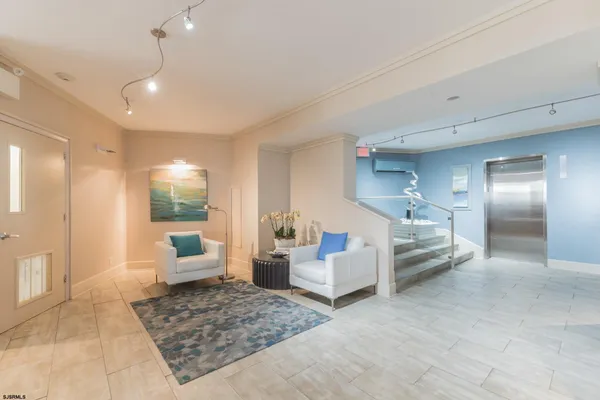 a living room with furniture and a rug