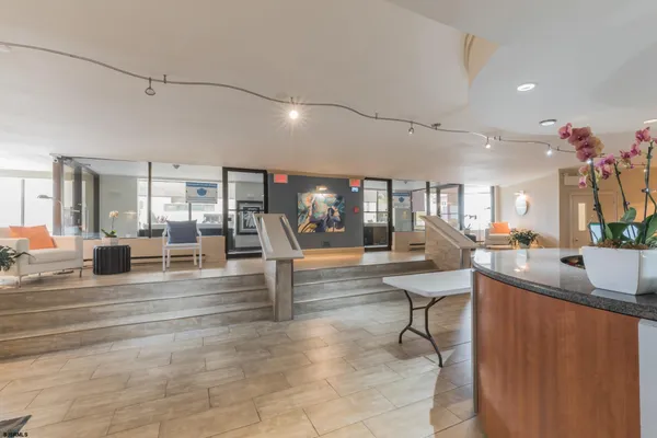 a view of a living room and kitchen