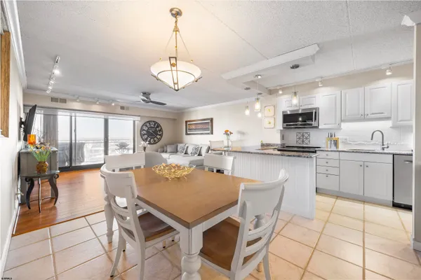 a view of kitchen with cabinets counter top space and stainless steel appliances