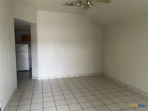 a view of an empty room and window