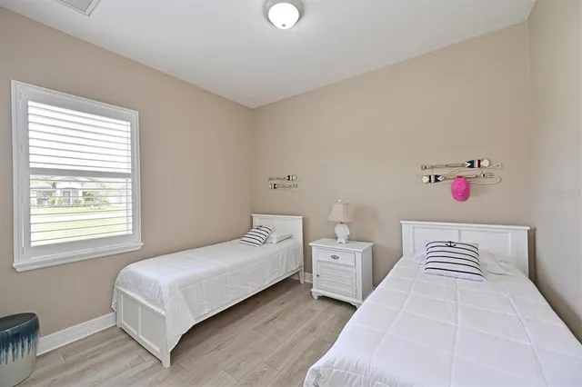 a bedroom with a bed and window