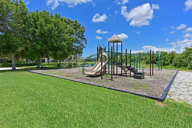a view of a park with plants and a bench