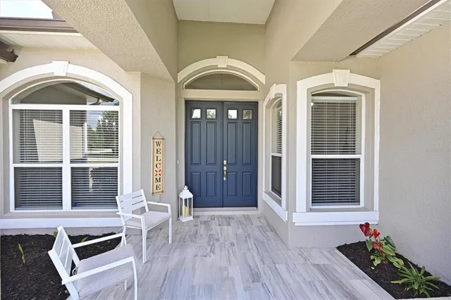 a view of a house with entryway and wooden floor