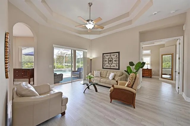 a living room with furniture and a large window