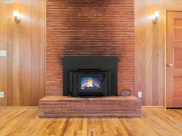 a bedroom with a bed and a fireplace