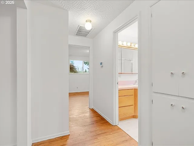 a view of an entryway with wooden floor