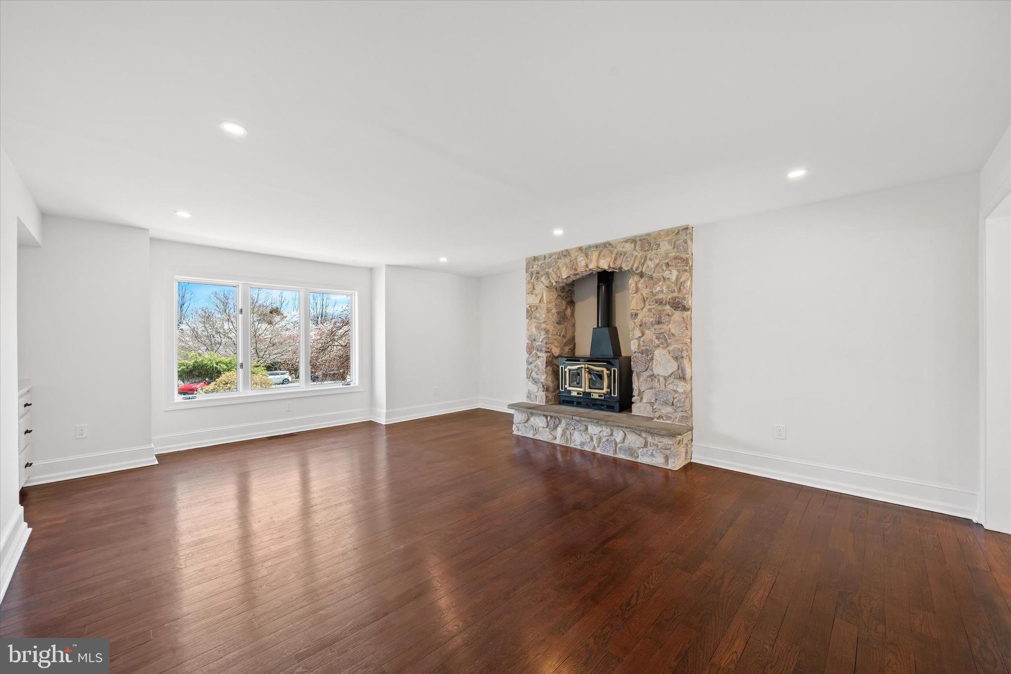 411 Hidden Valley Road Media, PA 19063 - Photo 43 of 90 an empty room with wooden floor and painting on the wall
