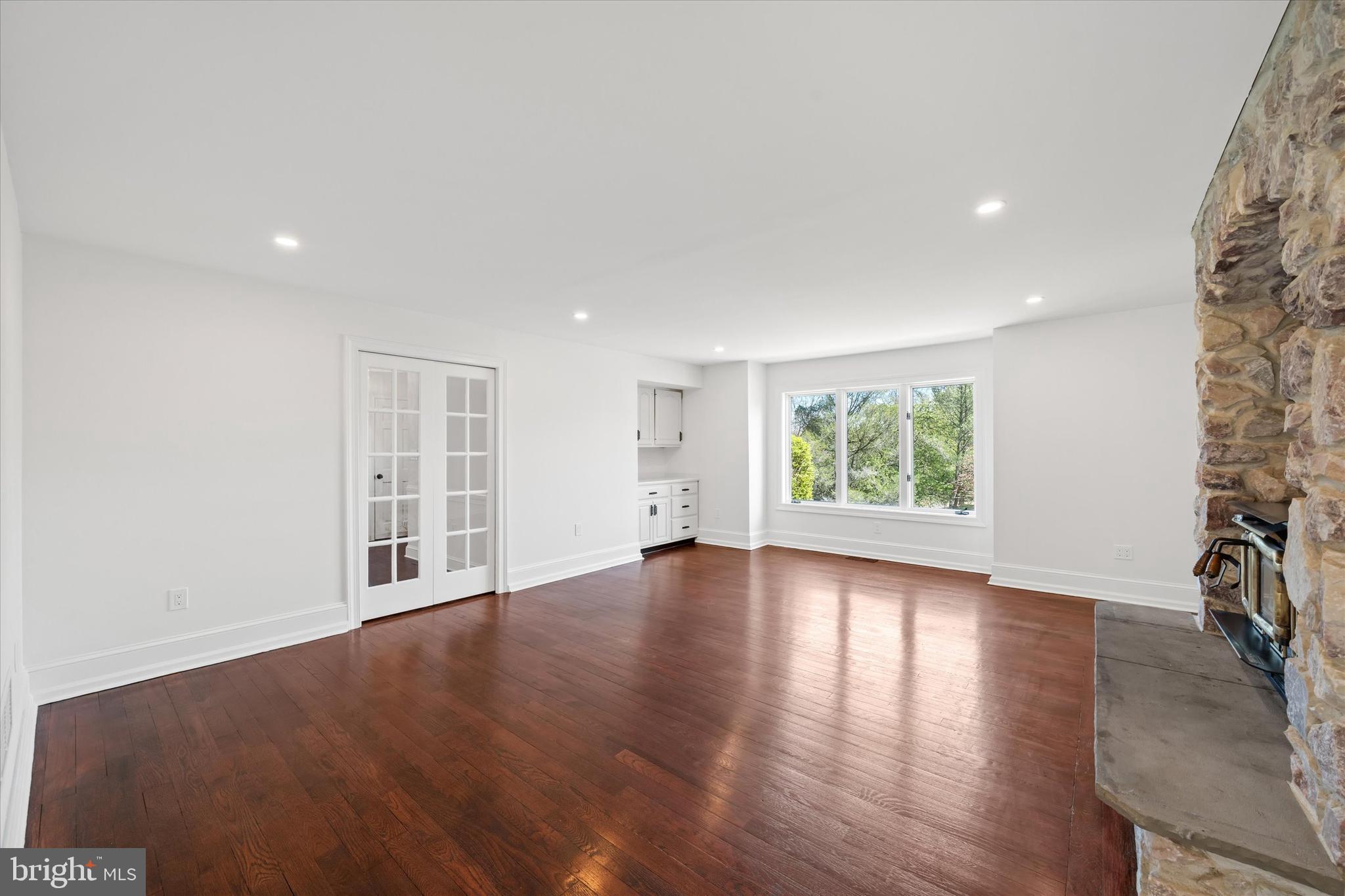 411 Hidden Valley Road Media, PA 19063 - Photo 45 of 90 a view of empty room with wooden floor and fan