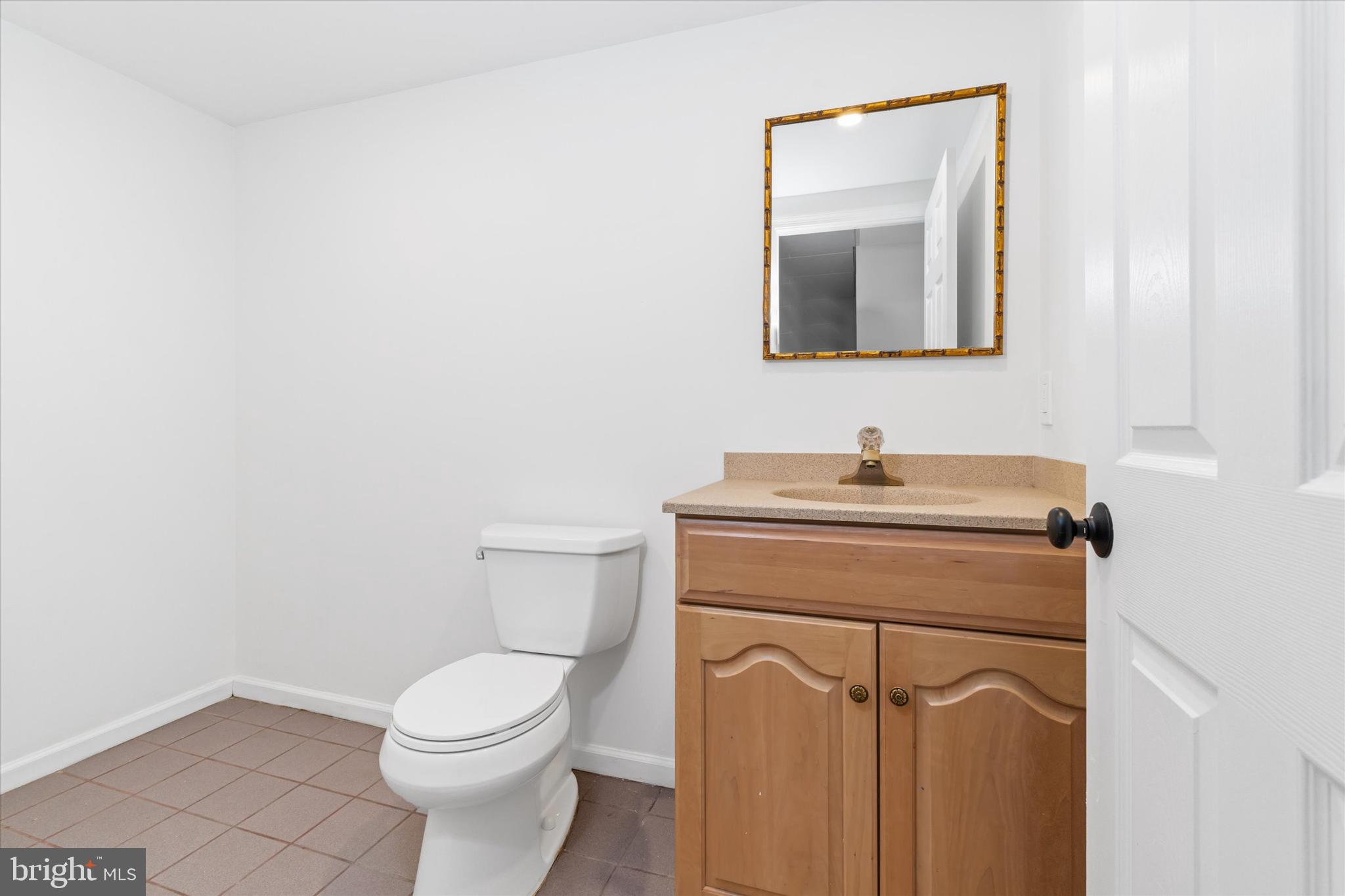 411 Hidden Valley Road Media, PA 19063 - Photo 72 of 90 a bathroom with a toilet sink and mirror