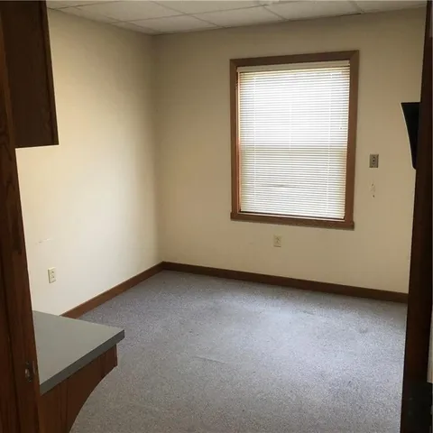 a view of a room with rack on the wall