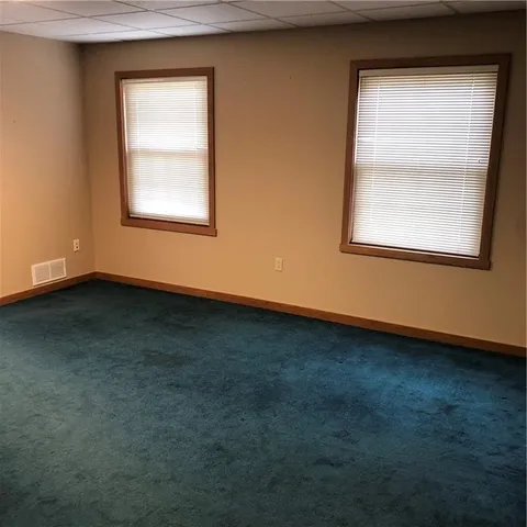a view of a tables and chairs in a patio
