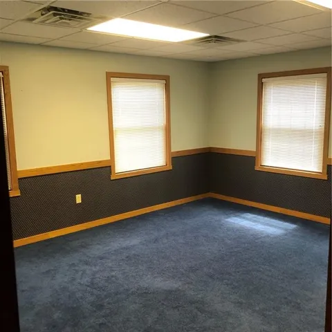 a shelf with cup and plates