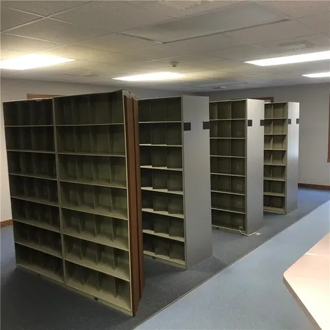 a bathroom with a sink toilet and a mirror