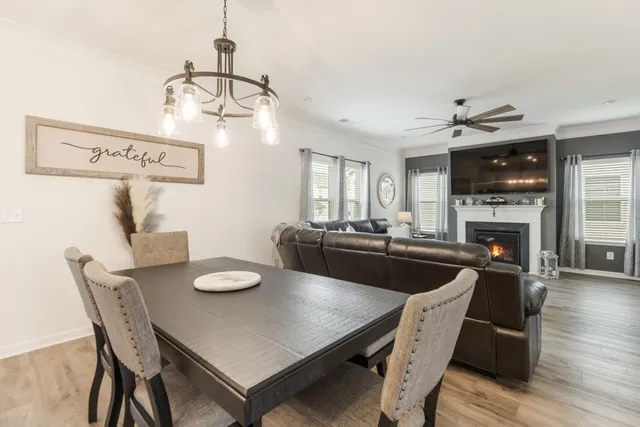 a bathroom with a double vanity sink toilet and shower