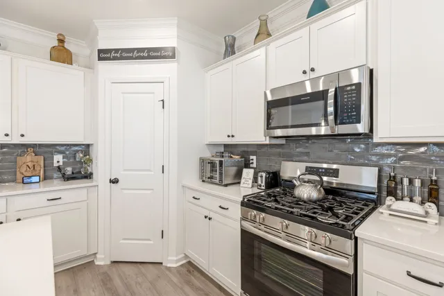 a view of a house with a yard and a garage
