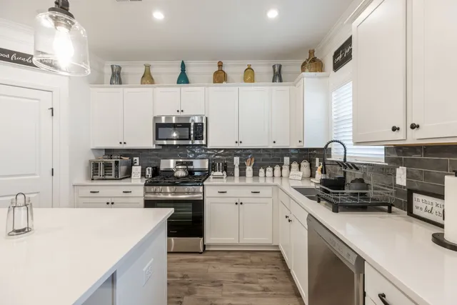 a kitchen with a stove and a microwave