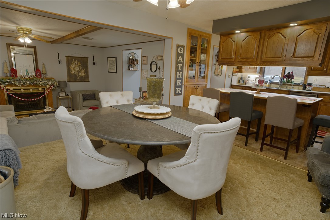 4061 Marks Rootstown, OH 44272 - Photo 11 of 25 Dining room with ceiling fan and light colored carpet