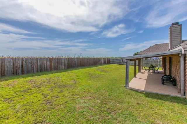 swimming pool with outdoor seating and garden