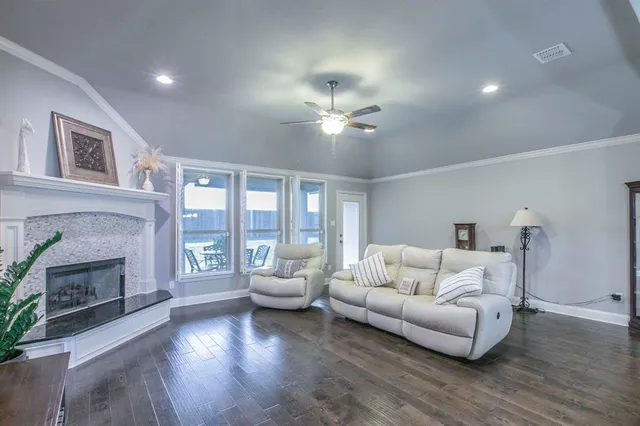 a living room with furniture and a fireplace