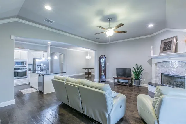 a living room with furniture and a fireplace