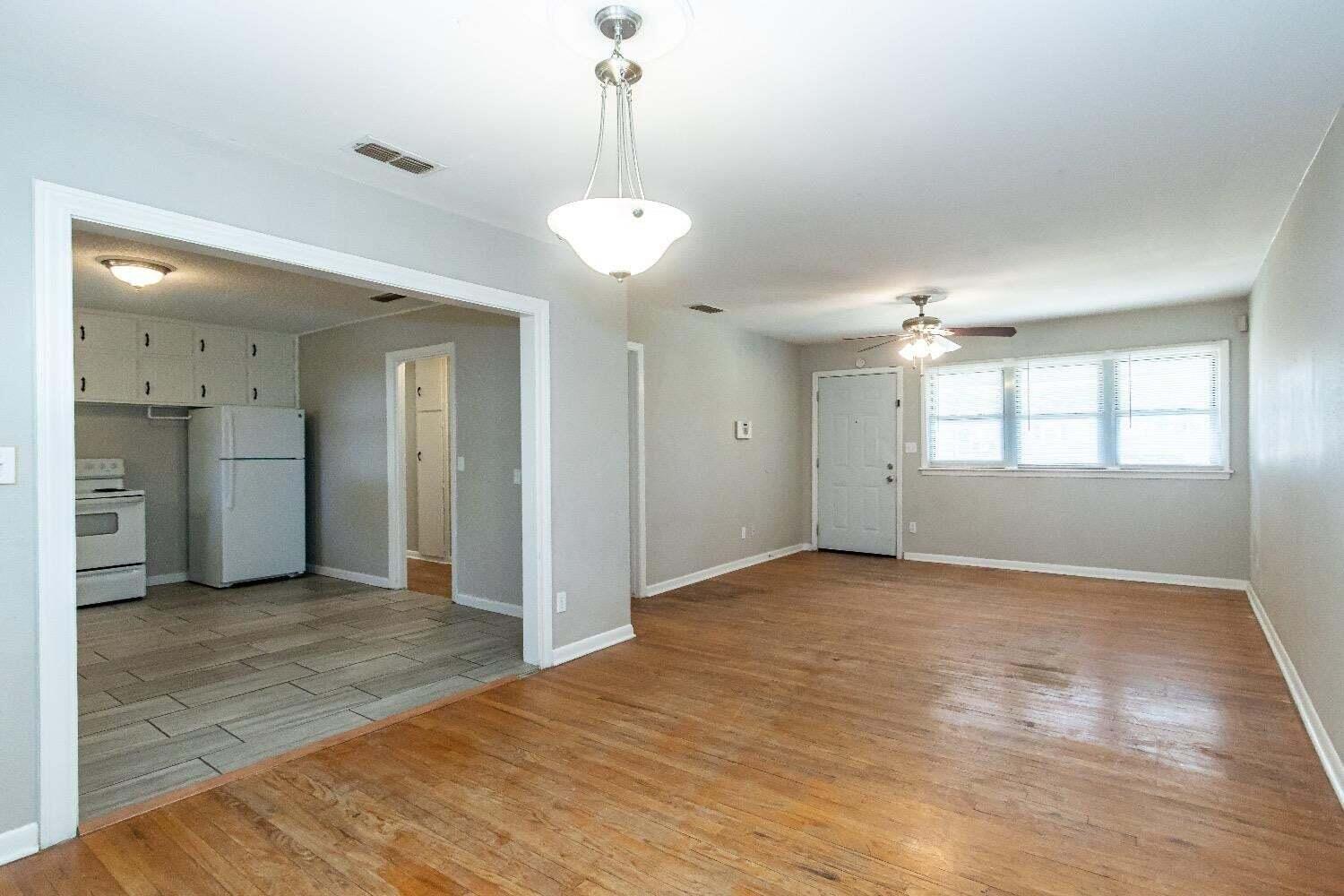 4212 42nd Street Lubbock, TX 79413 - Photo 6 of 18 a view of an empty room with a window