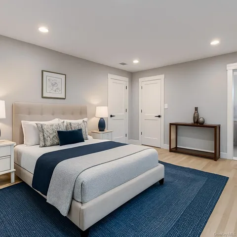 a spacious bedroom with a bed and a couch