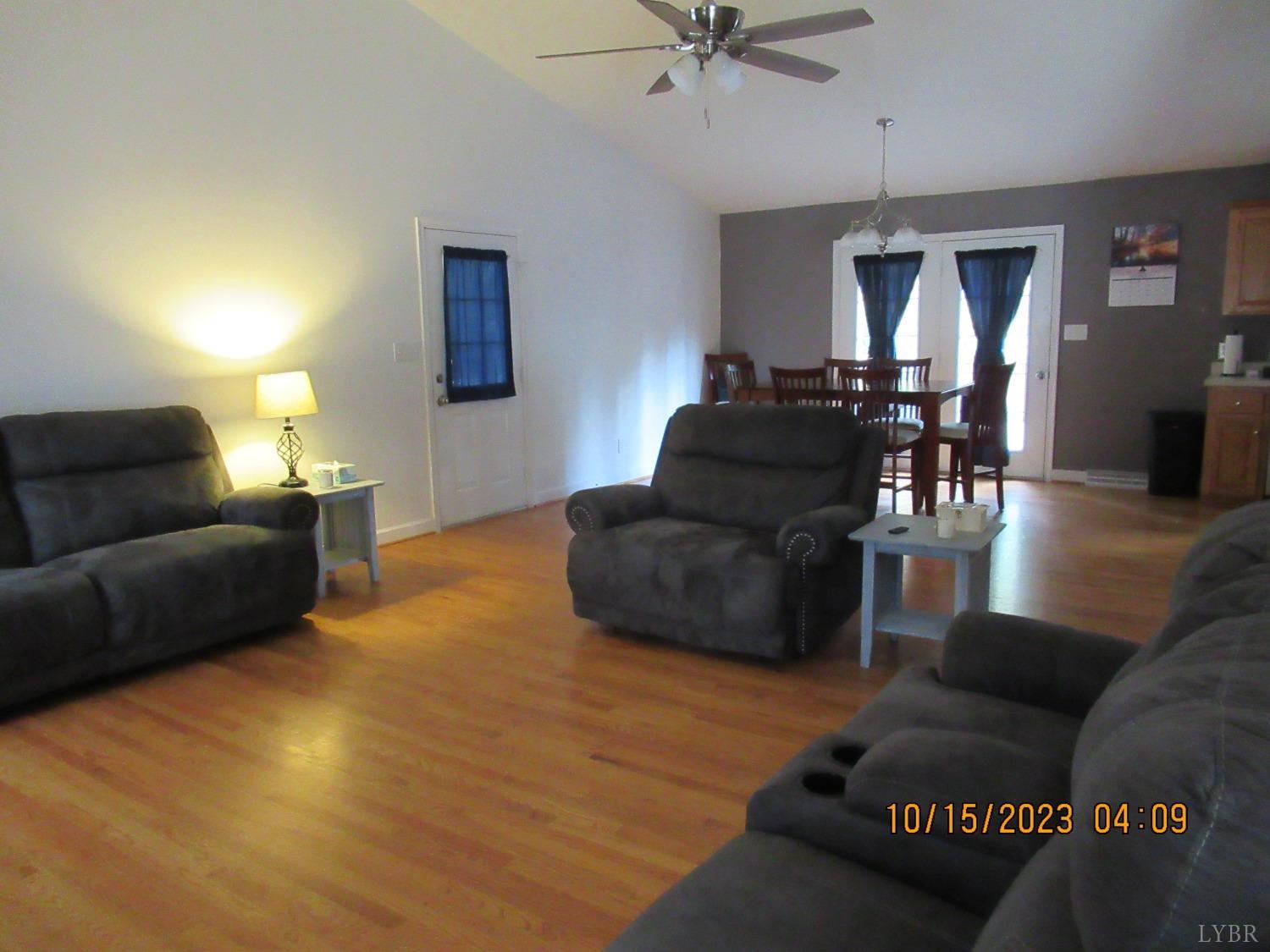 1360 Greenhouse Road Rustburg, VA 24588 - Photo 11 of 29 a living room with furniture and a wooden floor