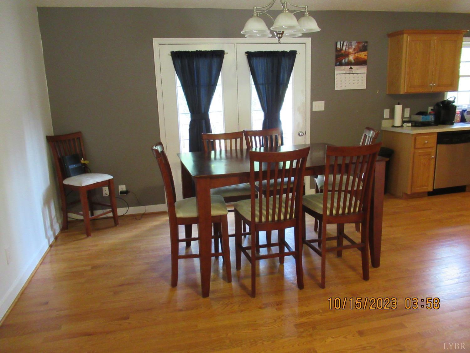 1360 Greenhouse Road Rustburg, VA 24588 - Photo 13 of 29 a view of a dining room with furniture and wooden floor