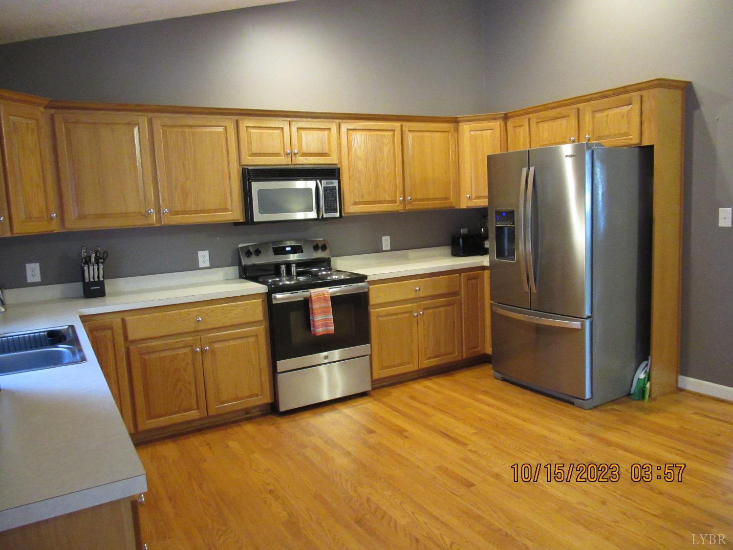 1360 Greenhouse Road Rustburg, VA 24588 - Photo 15 of 29 a kitchen with stainless steel appliances granite countertop a refrigerator stove top oven a sink and dishwasher
