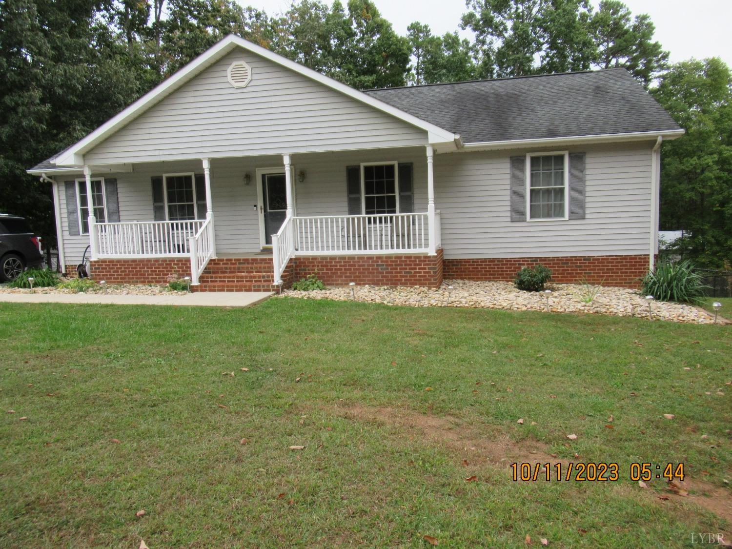 1360 Greenhouse Road Rustburg, VA 24588 - Photo 2 of 29 a front view of a house with a yard and garage