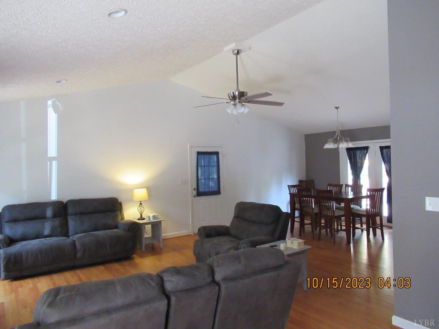 1360 Greenhouse Road Rustburg, VA 24588 - Photo 25 of 29 a living room with furniture and a dining table
