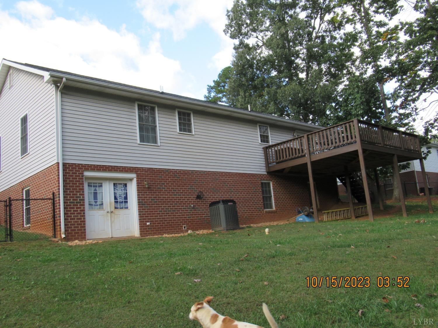 1360 Greenhouse Road Rustburg, VA 24588 - Photo 3 of 29 a front view of a house with a garden