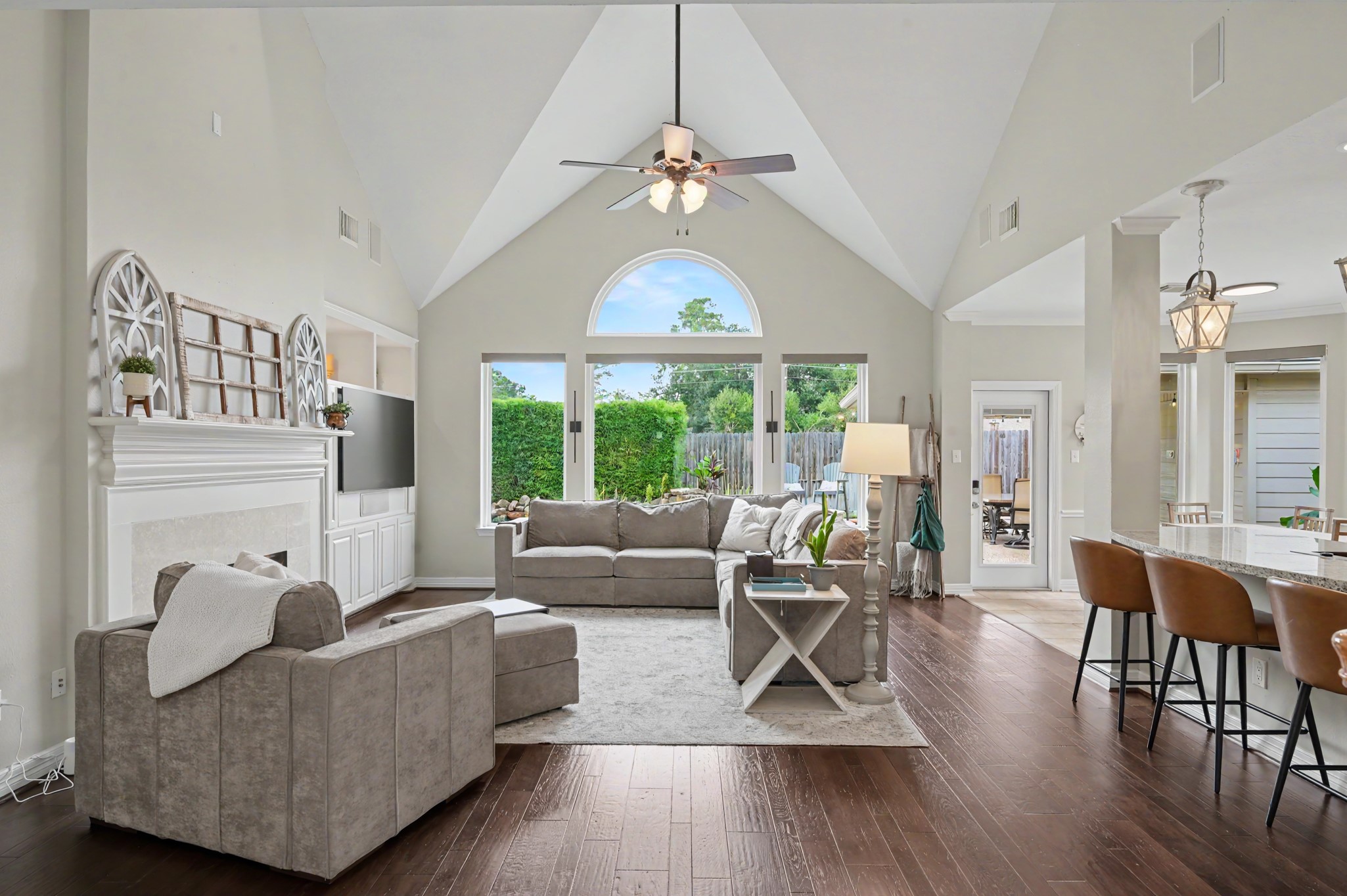 14938 Codys Run Cypress, TX 77429 - Photo 15 of 50 The family room features a vaulted ceiling, a wall of windows and engineered wood flooring. The window treatments have been upgraded to custom shades which can be left open or closed for privacy.