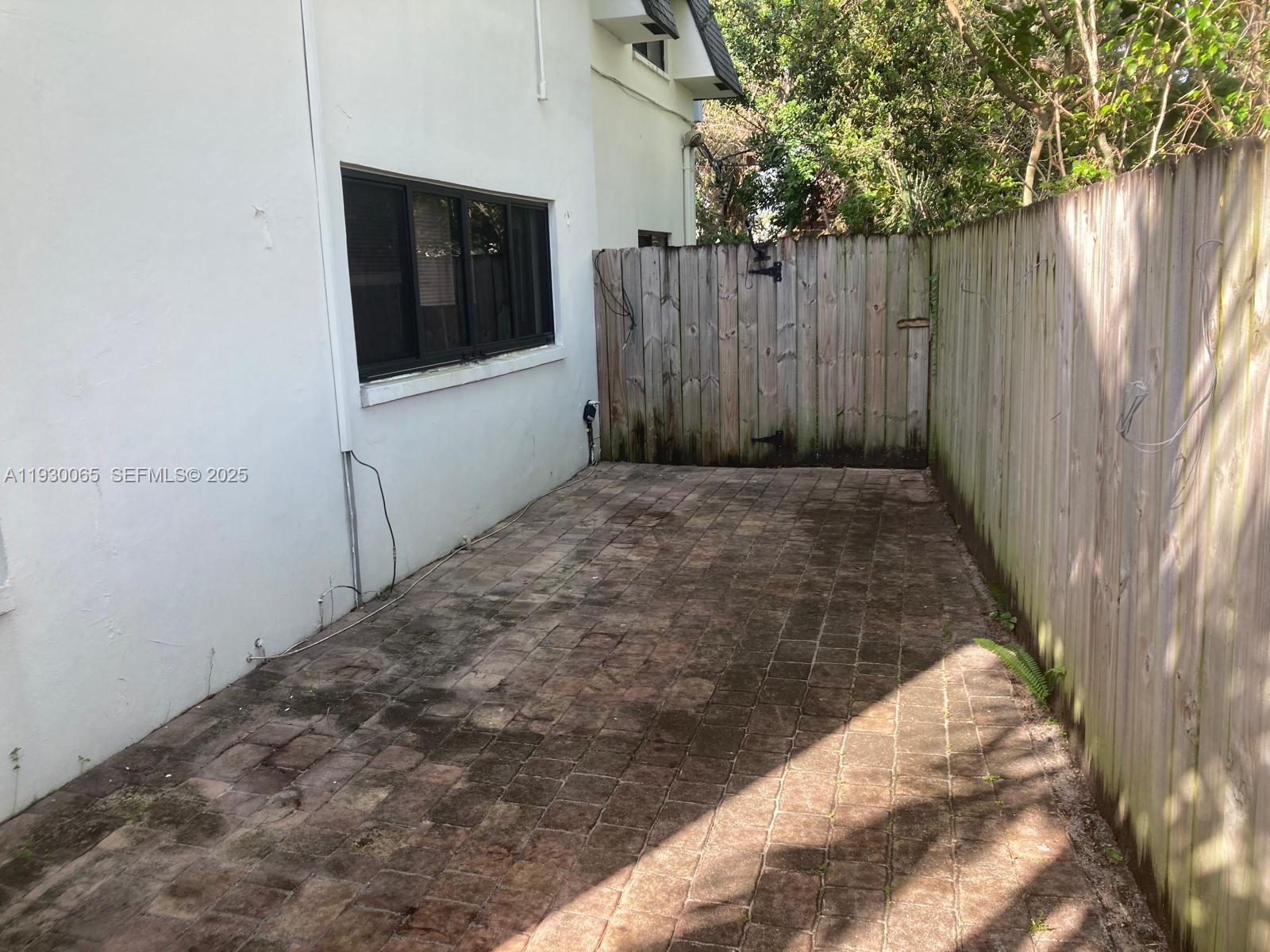 5731 Northeast 18th Avenue, Unit 4 Fort Lauderdale, FL 33334 - Photo 9 of 13 a view of a backyard of a house