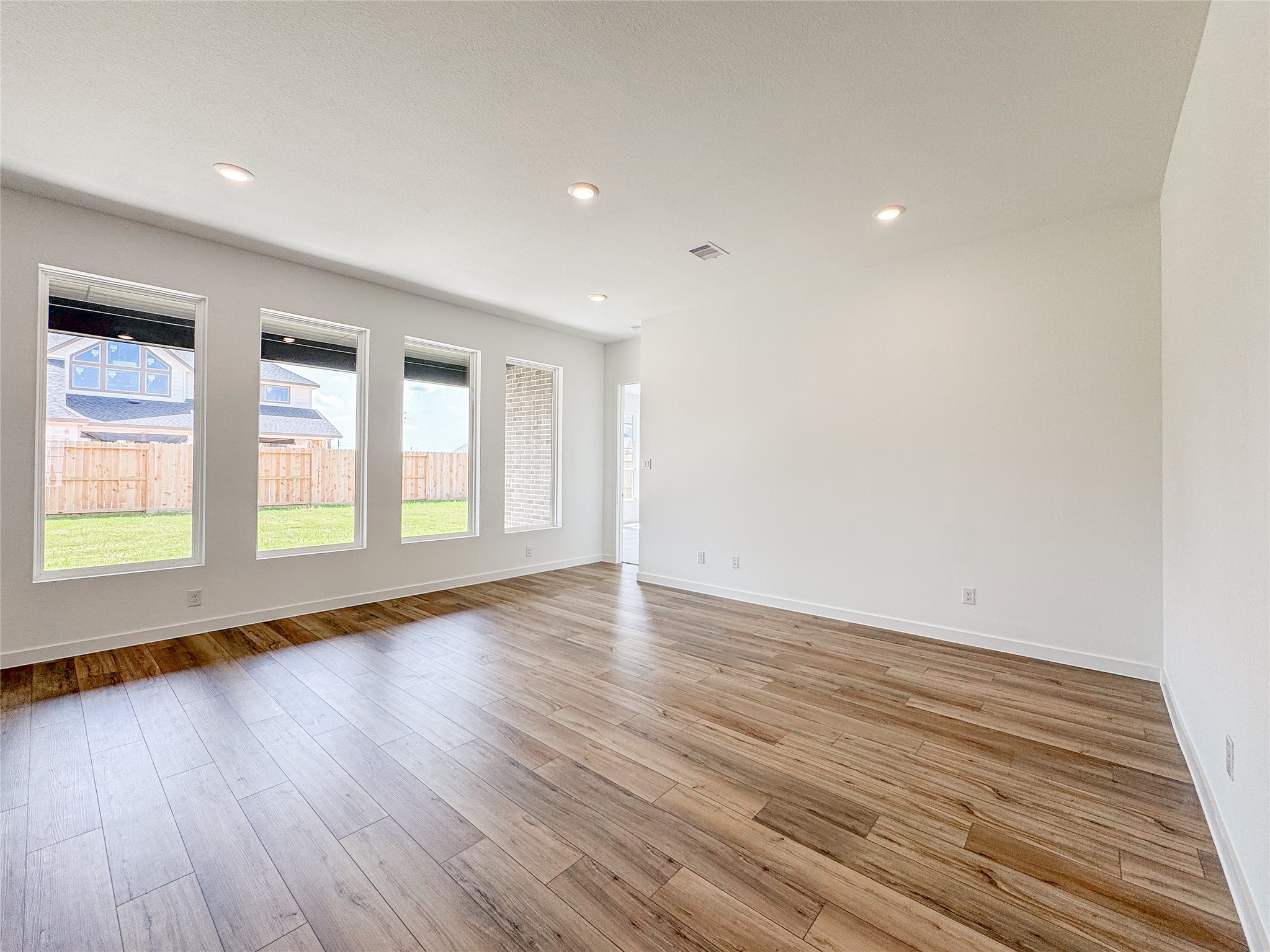 30939 Spring Lily Way Fulshear, TX 77423 - Photo 4 of 19 large open living area with ample light