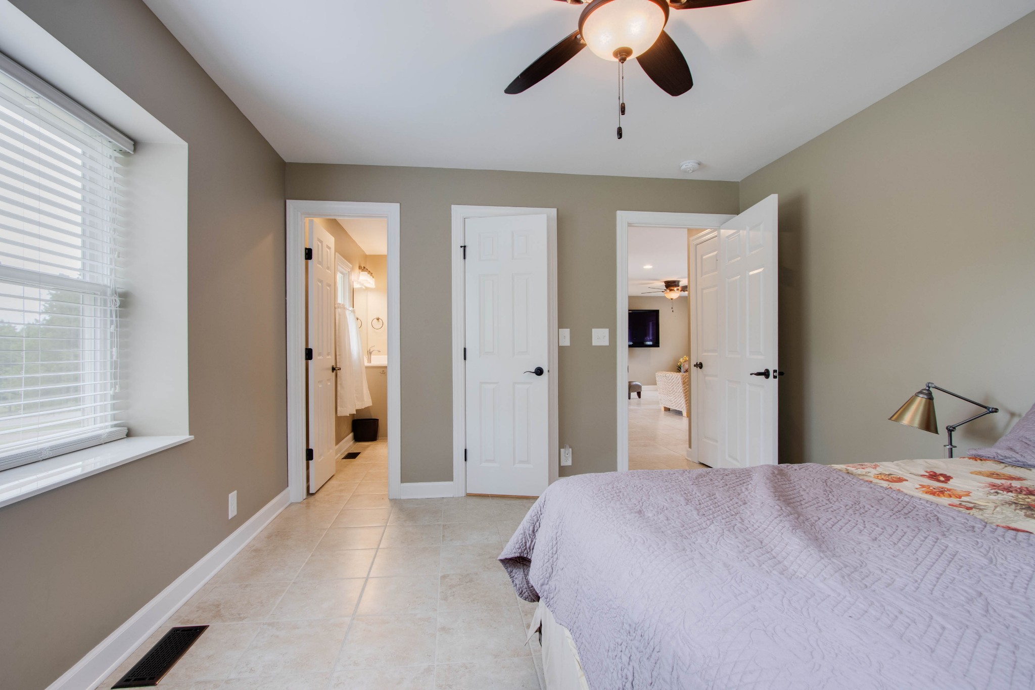860 Vanderbilt Road Mount Juliet, TN 37122 - Photo 20 of 65 a bedroom with a large bed and a chandelier