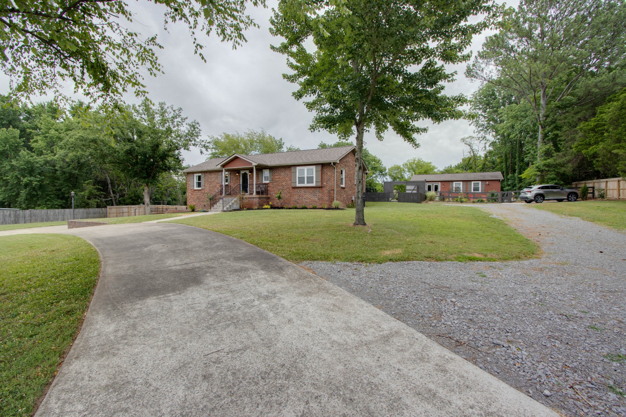 860 Vanderbilt Road Mount Juliet, TN 37122 - Photo 3 of 65 a front view of a house with a yard and trees