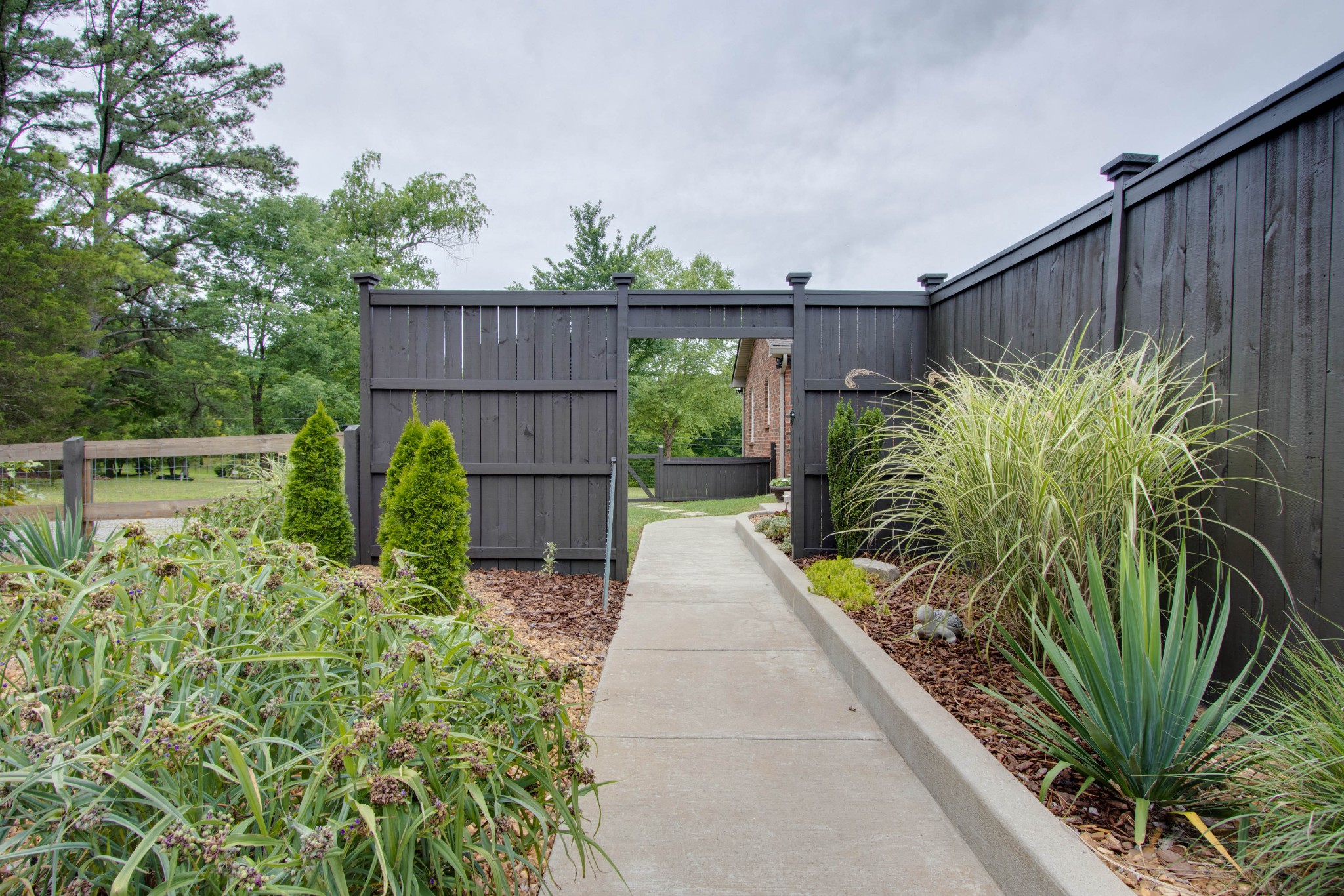 860 Vanderbilt Road Mount Juliet, TN 37122 - Photo 45 of 65 a view of a garden with wooden fence