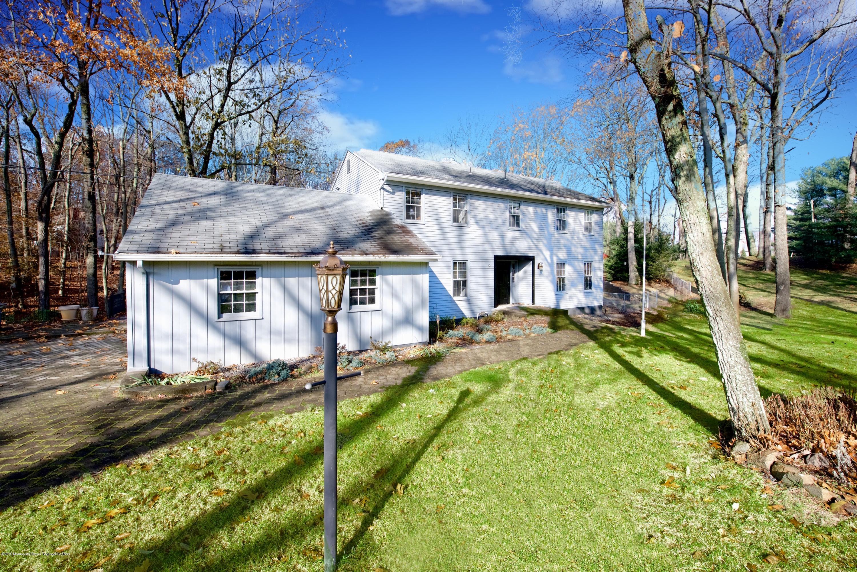 131 Millstone Road Millstone Township, NJ 08535 - Photo 1 of 27 a view of house with yard porch and furniture