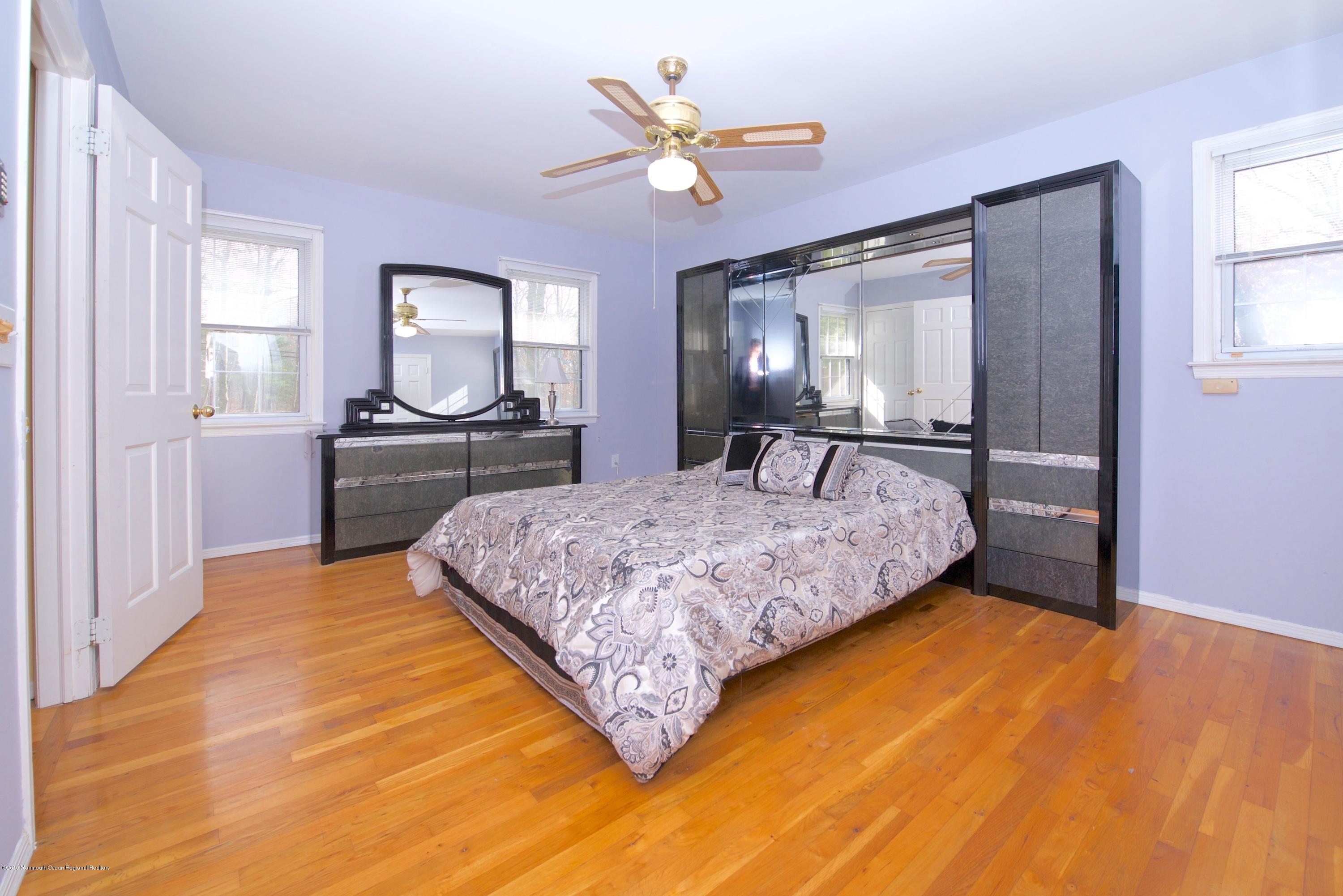 131 Millstone Road Millstone Township, NJ 08535 - Photo 15 of 27 a bedroom with a bed and window