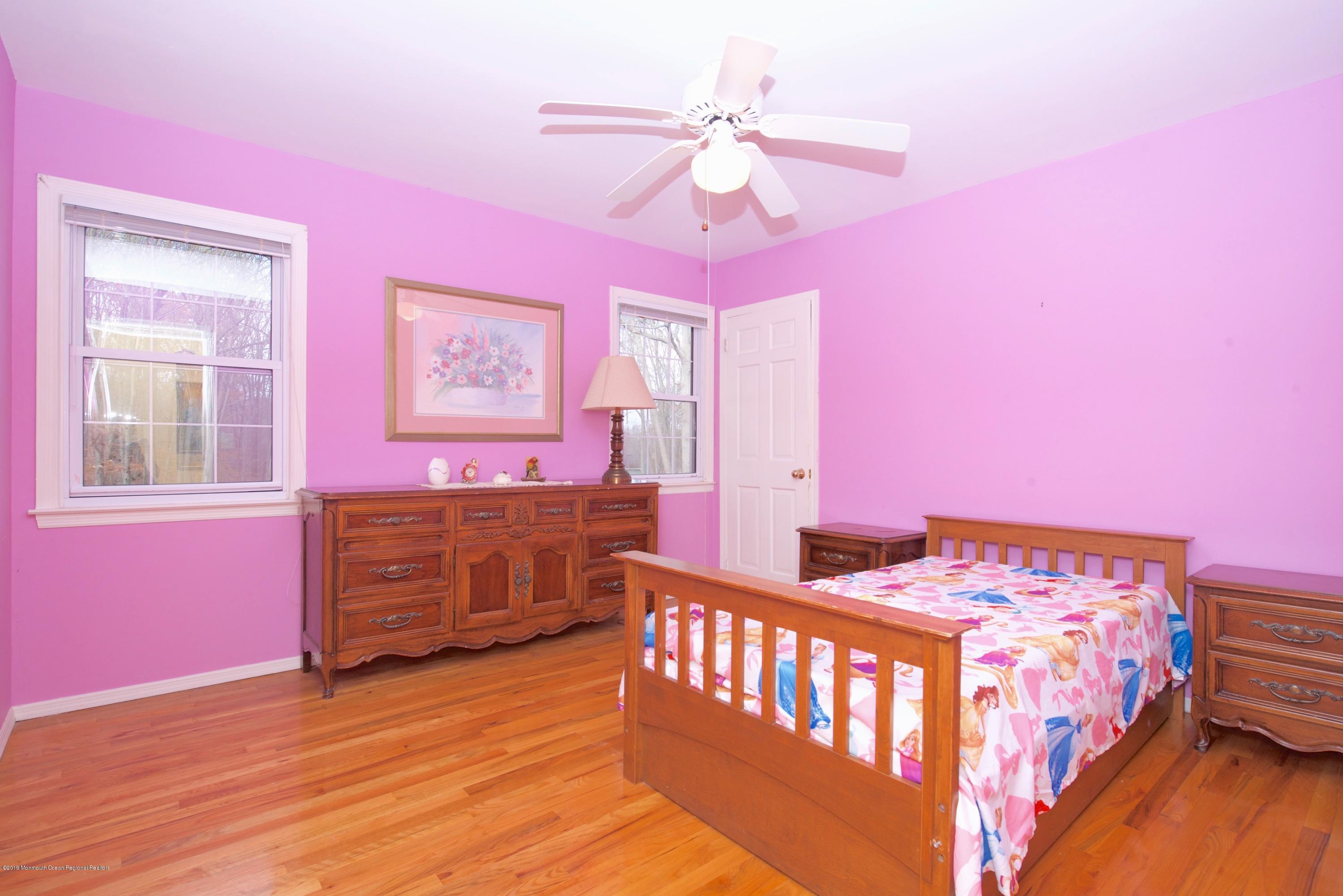 131 Millstone Road Millstone Township, NJ 08535 - Photo 17 of 27 a bedroom with pink walls and pink walls