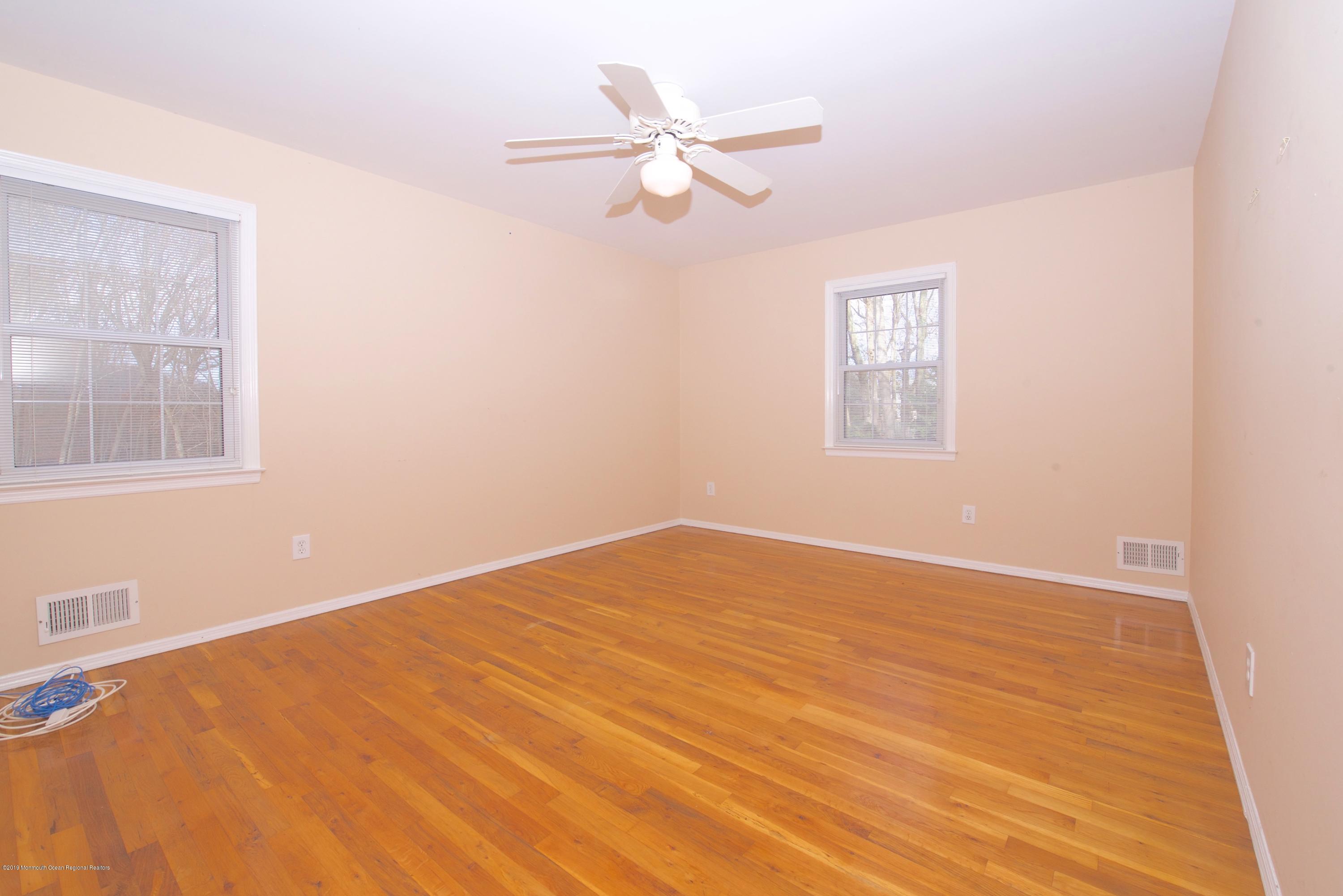 131 Millstone Road Millstone Township, NJ 08535 - Photo 22 of 27 a view of an empty room with a window