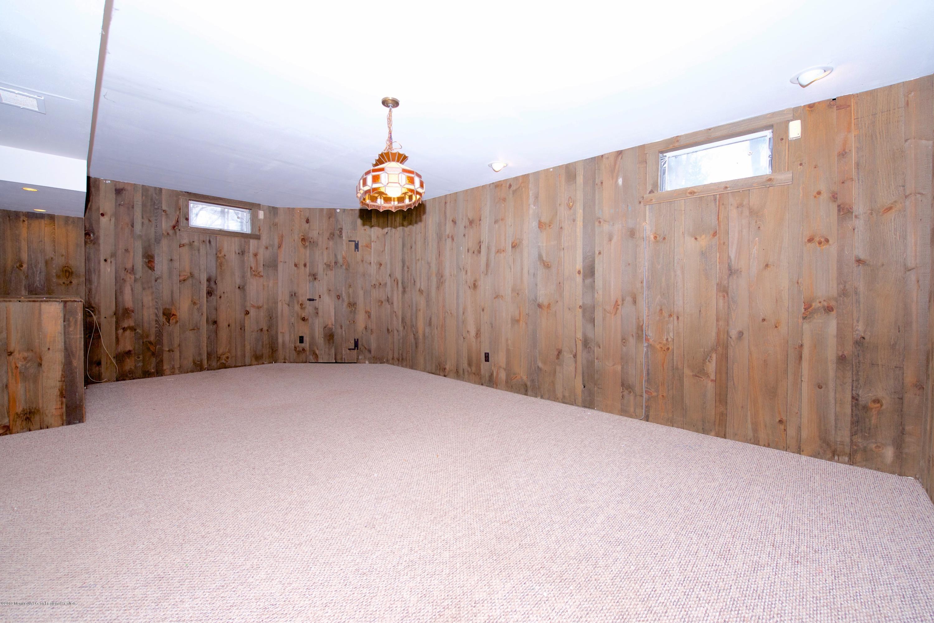 131 Millstone Road Millstone Township, NJ 08535 - Photo 25 of 27 a view of a big room with a wooden wall