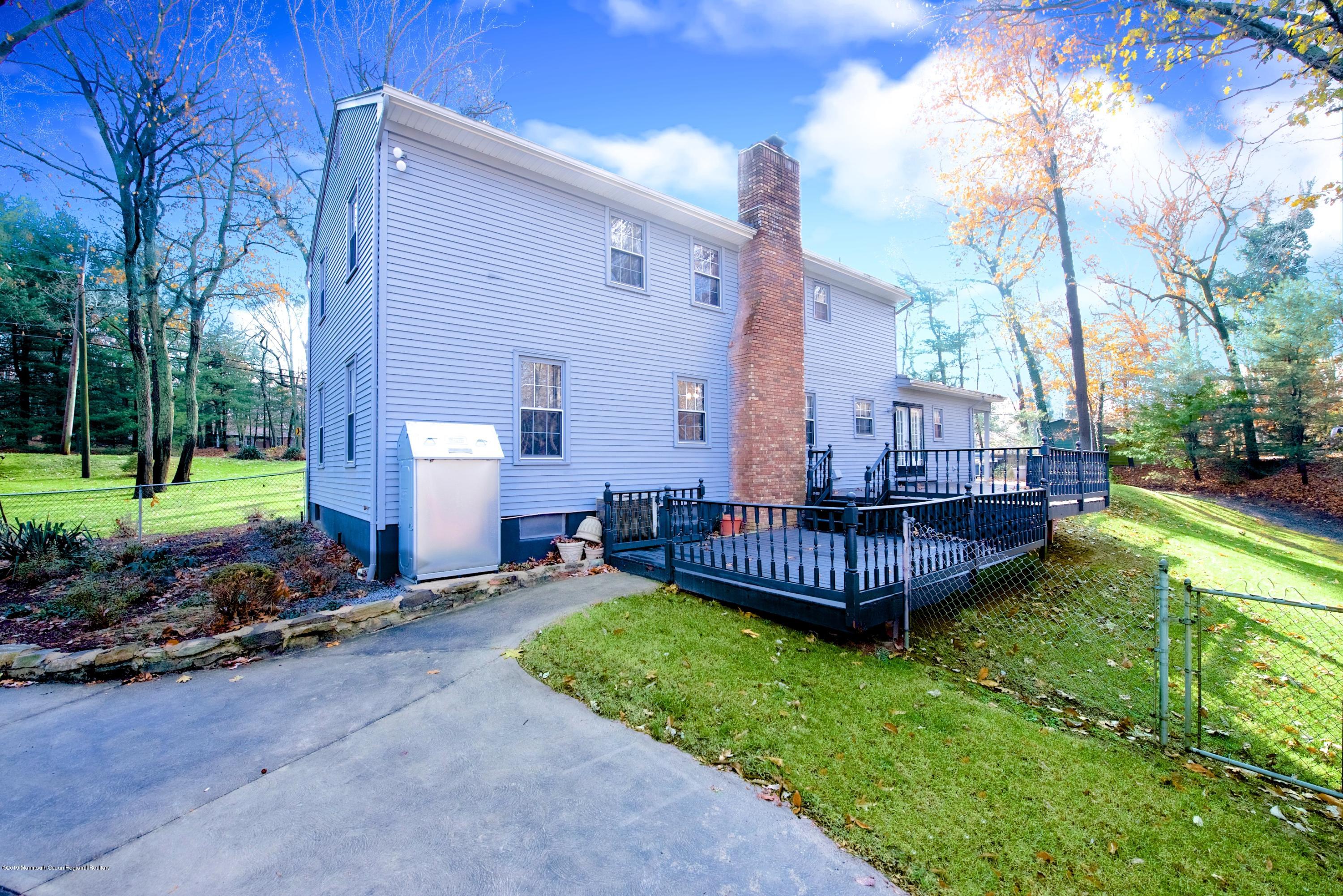 131 Millstone Road Millstone Township, NJ 08535 - Photo 26 of 27 a view of a house with backyard and sitting area