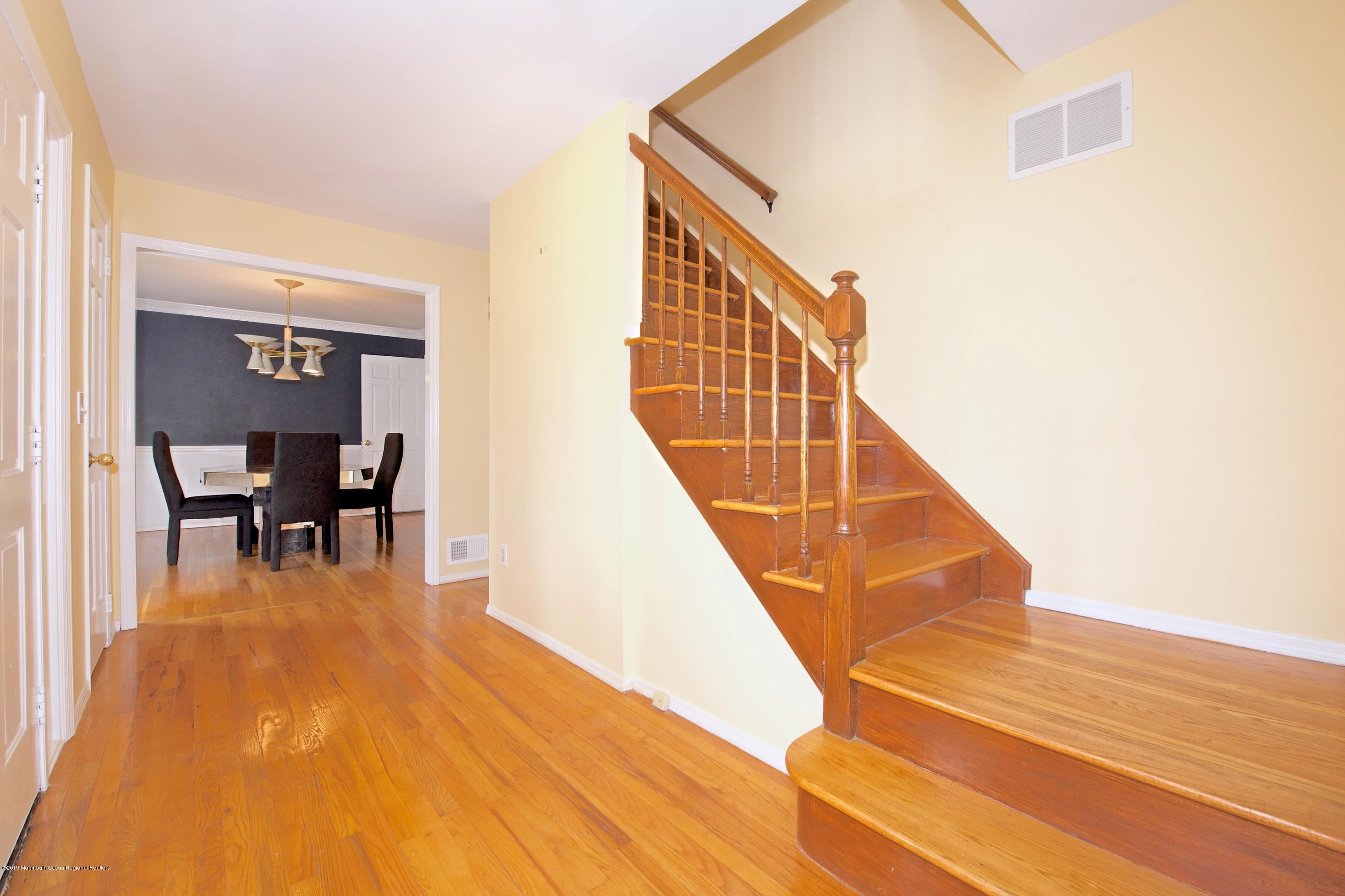 131 Millstone Road Millstone Township, NJ 08535 - Photo 3 of 27 a view of a livingroom with furniture and wooden floor