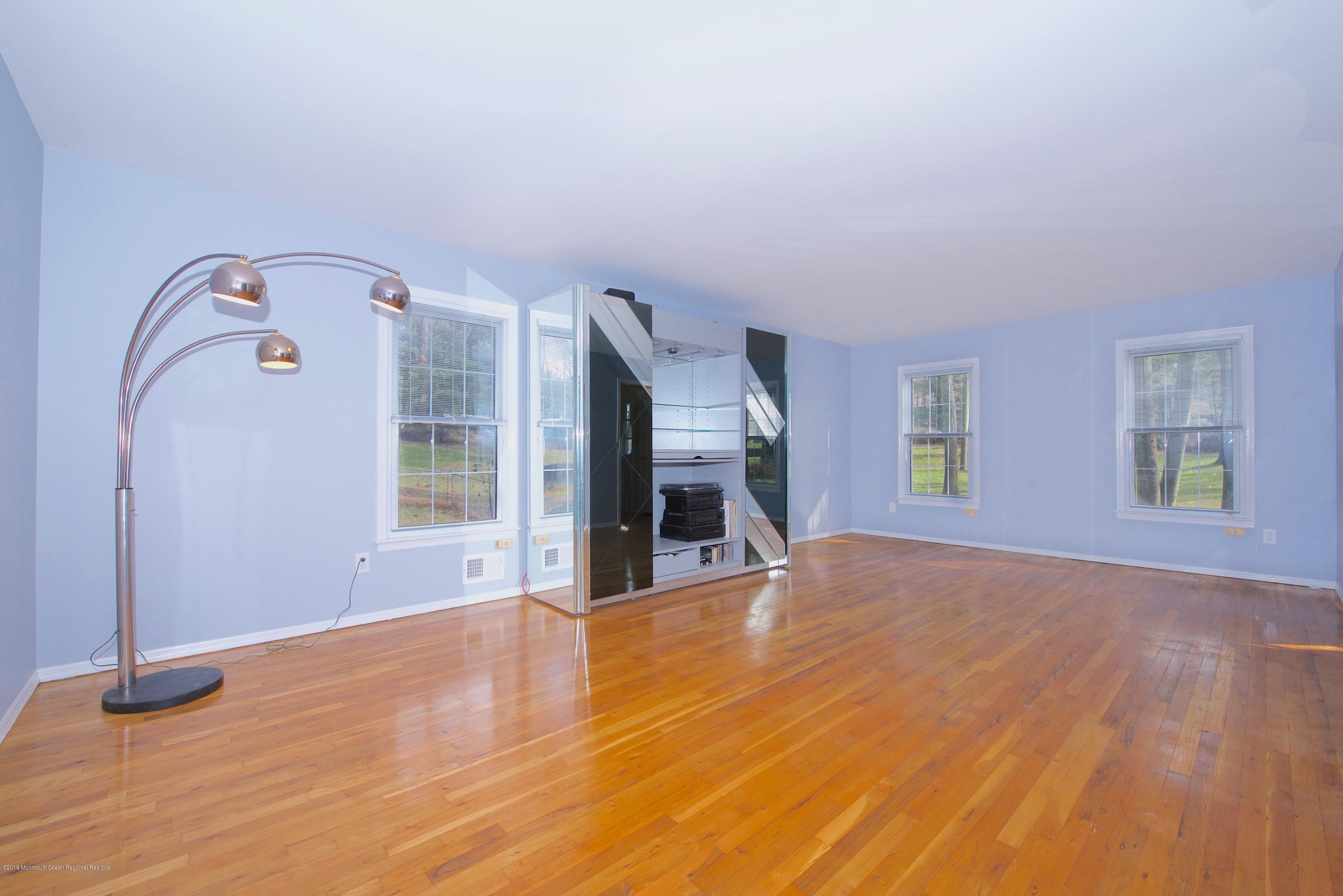 131 Millstone Road Millstone Township, NJ 08535 - Photo 5 of 27 wooden floor fireplace and natural light in room