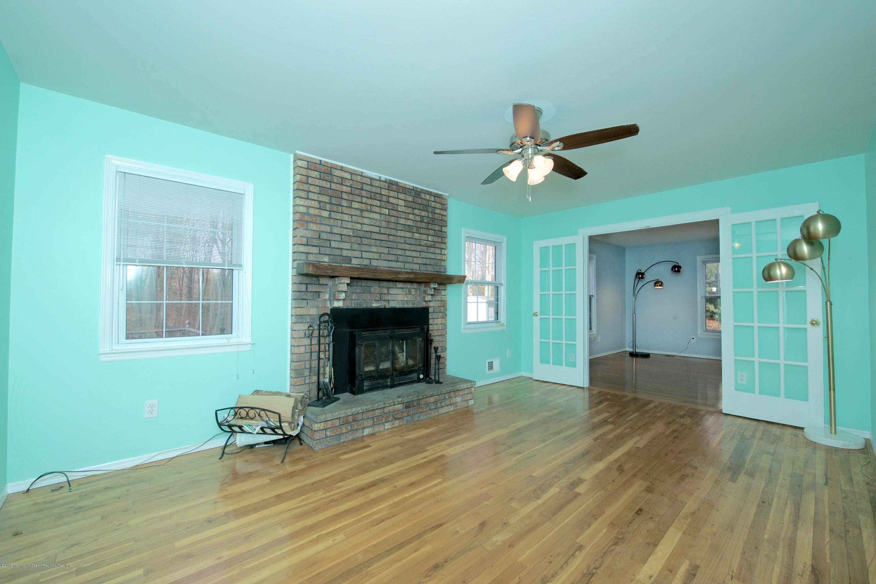 131 Millstone Road Millstone Township, NJ 08535 - Photo 8 of 27 a view of a livingroom with a fireplace and window