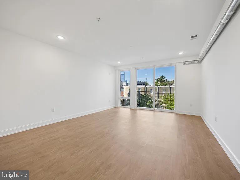 1614-20 Ridge Avenue, Unit 504 Philadelphia, PA 19130 - Photo 17 of 17 a view of empty room with wooden floor